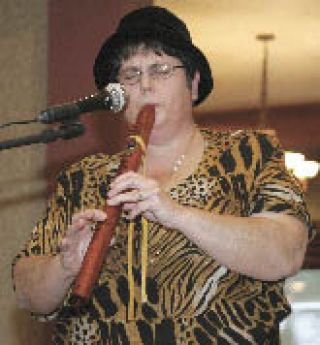 Free instruction on the Nativer American-style flute will be offered tomorrow at 6:30 p.m. by the Spirit Song Flute Circle at St. George Episcopal Church in Maple Valley. More information is available from group leader Lisa Gillotti (above) at (425) 235-0400.