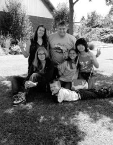 Posing with one of their exchange students from China are the Burianek family – from left