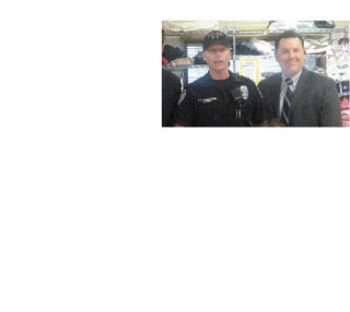 Officer Kris Chatterson (left) represented the Black Diamond Police Department as a donation of $3