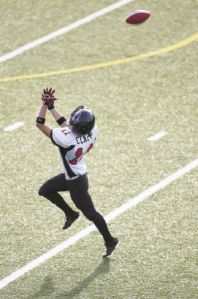 Wide receiver Karlene Clapp reaches to catch a pass during a Seattle Majestics practice at French Field. As the state’s only all-women tackle football team
