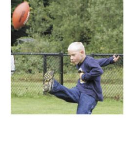 Garrett Sauenoein gets his leg into a kick on his way to winning the 7-to-9-year-old age group in the Punt