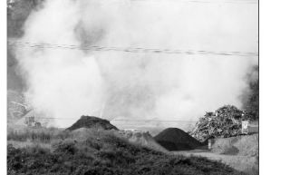 The Rainier Wood Recyclers facility was still shrouded in billowing smoke last Thursday