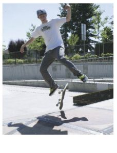 Johnny Hill casts a shadow as he kick-flips onto the pyramid at the skate park in Covington. It’s a summer pasttime that will end next week when students in the Tahoma and Kent school districts head back to school on Sept. 2.