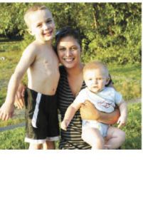 Alex Hughes and her sons William (left) and Christian basked in the late-afternoon sun while enjoying the lake and music.