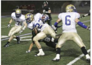 Tahoma’s Chris Marangon (23) rushes down the left sideline for a 28-yard gain on a fake punt during Thursday night’s game against Kentwood at French Field.