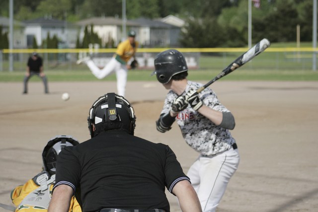 Kentlake junior Caleb Jaime watches as a pitch from Kentridge comes into home plate during the Thursday match up at home. Photo by Sarah Brenden