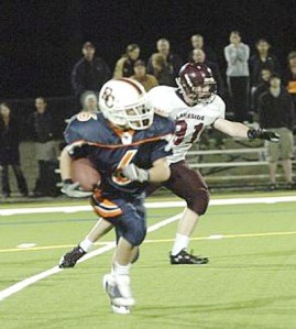 AJ Hostak of Maple Valley carries the ball for Eastside Catholic last fall.