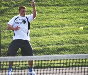 Kentlake’s Derek Welch returns serve against Tahoma’s in a match Oct. 4 at Tahoma High School. Welch is one of the top boys tennis singles player in the South Puget Sound League North.