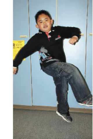 Makana Macomber demonstrates his tae kwon do skills