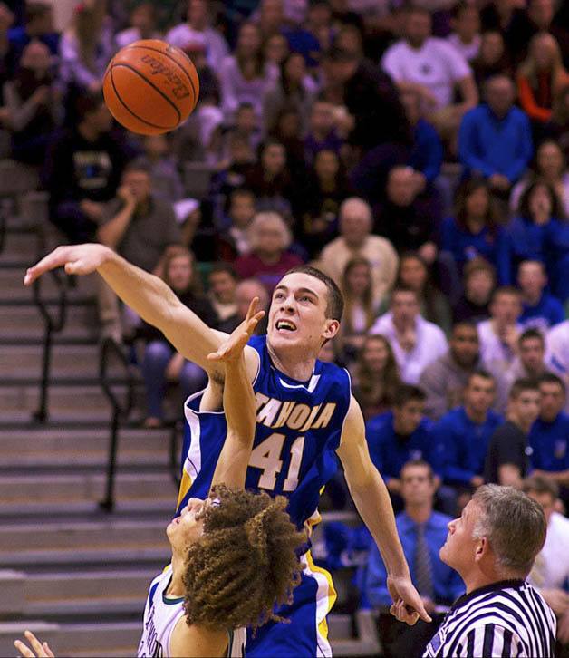 Tahoma’s Paul Loranger battles with Kentwood’s Terence Grady Nov. 30 in a contest the Bears ran away with to start league play. Tahoma looks to have a memorable season.