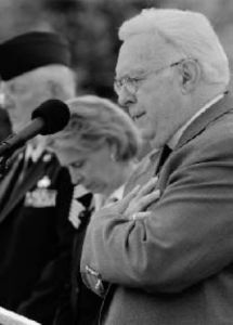 Governor Christine Gregoire bows her head during the invocation by chaplain Delmer Robinson during the Memorial Day ceremony Monday at Tahoma National Cemetery. See page 7 for related photos.