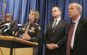 Sheriff Sue Rahr speaks at a press conference on proposed budget cuts by King County that she would “severely” limit the countywide criminal justice system’s “ability to deal with crime.” Flanking her are (from left) District Court Presiding Judge Barbara Linde