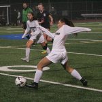Kentwood freshman Isabella Cromwell drives the ball downfield for the Conks girls soccer team against Union Nov. 5 at Tahoma High Stadium. Dennis Box, The Reporter