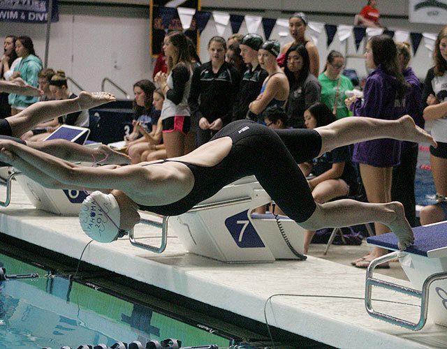 Lindsey Hanger, Tahoma senior, at the start of the 100-yard freestyle Saturday at the King County Aquatics Center. More swim photos on page 15. DENNIS BOX, The Reporter