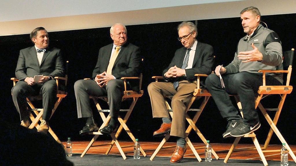 Dave Wyman, former Stanford and NFL linebacker, far right, fields a question from the audience during a Town Hall on Concussions & Youth Sports at the Kentwood High School Performing Arts Center in Covington on Tuesday night. Dr. Stan Herring, former Seahawks team physician, third from the left, and Dave Lutes, Kent School District athletic director, second from the left, joined the panel to discuss head injuries and importance of safety in youth sports today. Danny O&rsquo;Neil, 710 ESPN Seattle Radio host, far left, moderates. RACHEL CIAMPI, Kent Reporter