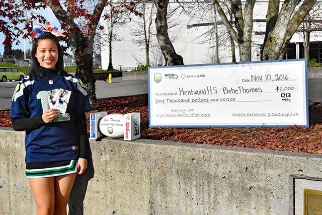 Kentwood senior Alexia Thomas was named CenturyLink High School Athlete of the Week. On Nov. 10 she was presented with two game tickets, a jersey, Seahawks football and a $1,000 check for Kentwood&rsquo;s Athletic Department. Contributed photo