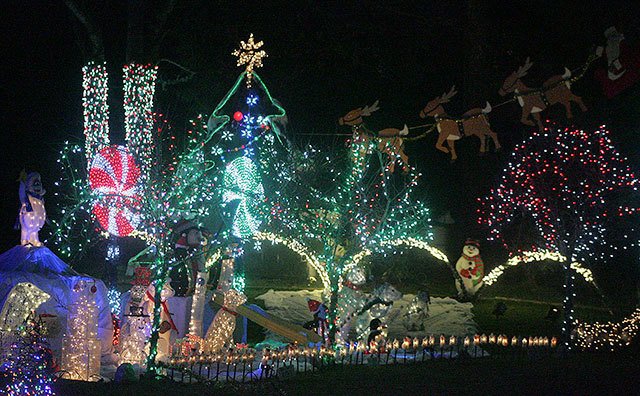 Running from dusk until 11:30 p.m. holiday lights come to life at this Covington home. Photo by Dennis Box