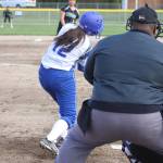 Hazen senior Tonee Greising swings for a pitch from Kentwood junior Lagi Palaita Thursday.