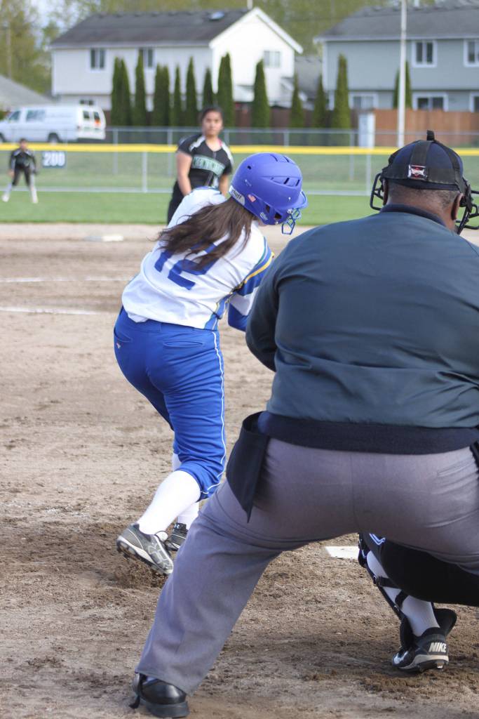 Hazen senior Tonee Greising swings for a pitch from Kentwood junior Lagi Palaita Thursday.