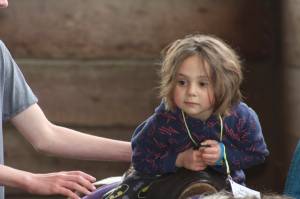 Kids play with ponies during Western Days at Reber Ranch