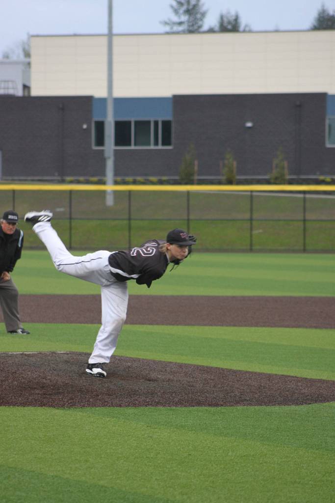 Kentlake junior Jordon Wright throws a pitch during Wednesday&rsquo;s game to a Tahoma batter.