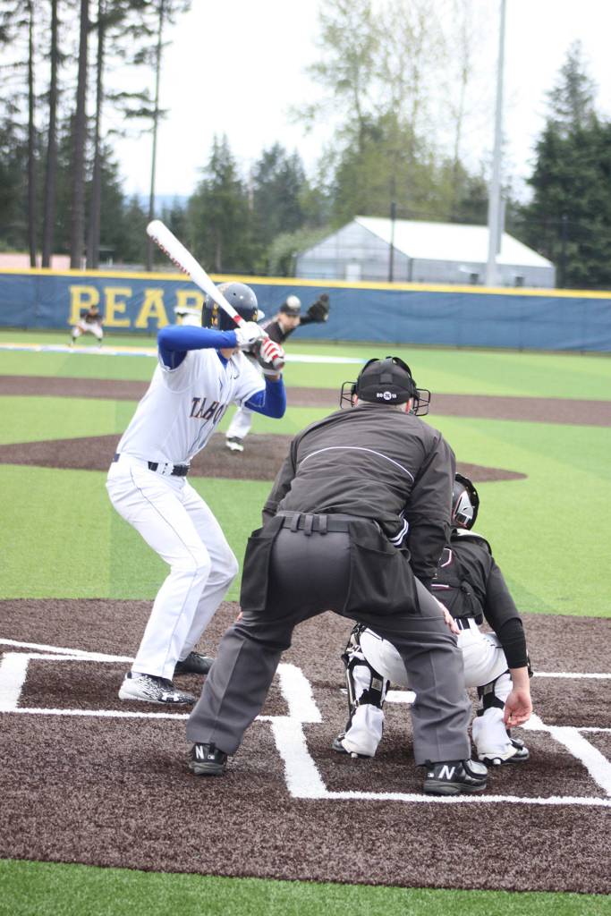 Tahoma freshman Cameron Green looks on as Kentlake junior Jordon Wright releases the ball Wednesday.