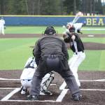 Tahoma junior Josh Leonard throws a pitch to Kentlake senior Kyle Combs Wednesday at the new Tahoma High School. The Falcons won 7-3. SARAH BRENDEN, The Reporter