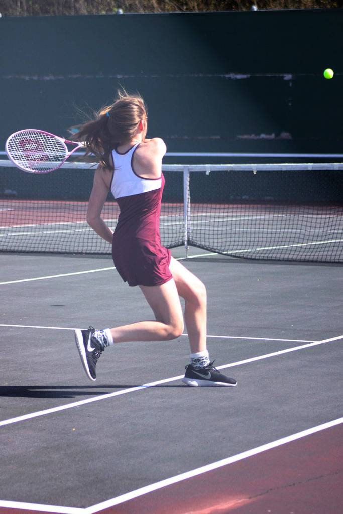 Amy Bender from Kentlake volleys during her win over Kentwood&rsquo;s Brianna Stroud. Bender won the match 6-2, 6-0.