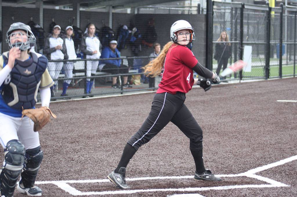 Kentlake sophomore Naomi King watches her foul ball leave the field.