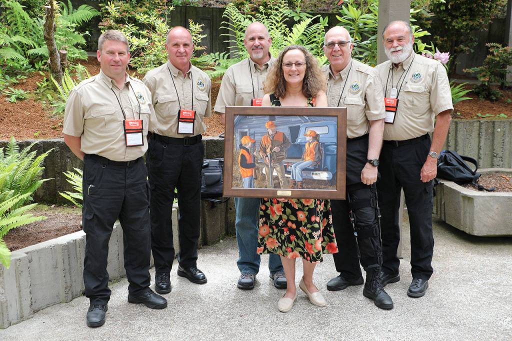 Cathy Lynch, an employee in the Kent School District&rsquo;s transportation department, recently received the Washington Department of Fish and Wildlife&rsquo;s Terry Hoffer award. She is joined by Washington Department of Fish and Wildlife (WDFW) hunter education and volunteer coordinator staff. From left, are Aaron Garcia, Mike Whorton, division manager Dave Whipple, Lynch, Lynch&rsquo;s coordinator Steven Dazey and Chuck Ray. COURTESY PHOTO, WDFW