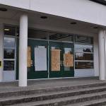 The entrance to the Kentwood High School Performing Arts Center was boarded up on Friday after two men allegedly vandalized the school overnight. HEIDI SANDERS, Kent Reporter
