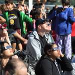 People take in the eclipse at the Museum of Flight. HEIDI SANDERS, Reporter