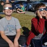 Jay Murison, 11, left, and his brother, Mason, 9, show off their eclipse viewing glasses. HEIDI SANDERS, Reporter