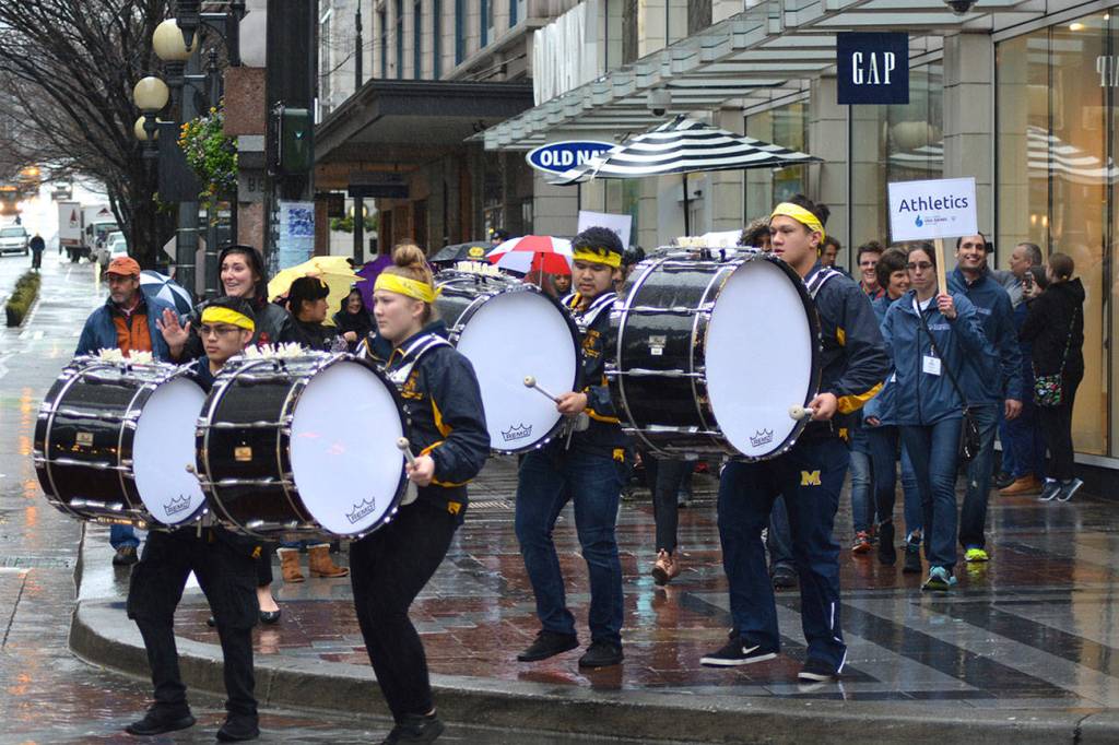 The band and all the Washington Special Olympic team members march down the streets of Seattle on Jan. 11 for the 2018 Special Olympics Home Team Announcement in Seattle on Jan. 11. Photo by Kayse Angel