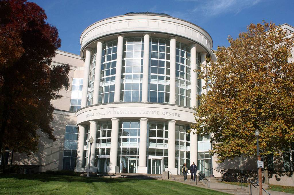 Kentwood science teacher charged with two counts, remains in custody