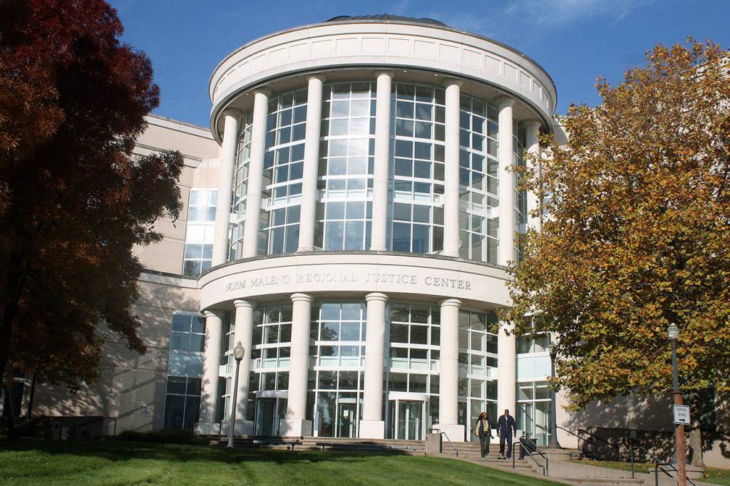 Kentwood science teacher charged with two counts, remains in custody