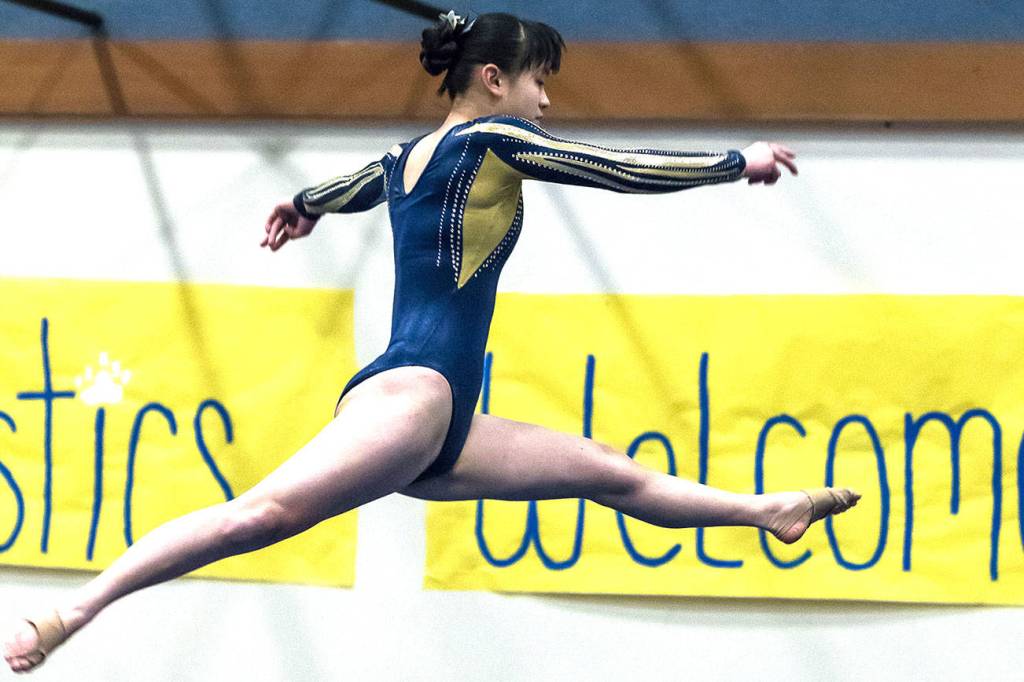 Emma Rochleau, a junior at Tahoma High School, does her routine on the beam during a previous meet. Photo by Kurt Audett