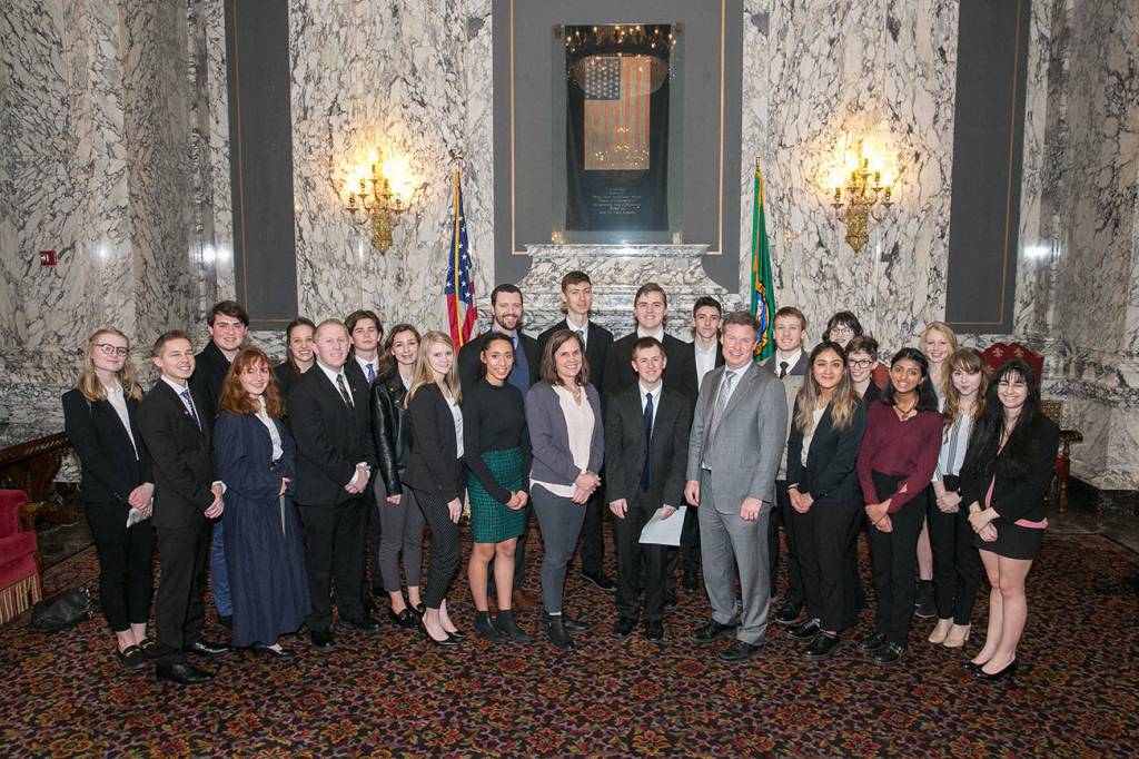 Students from Tahoma High Schools We the People team join Sen. Mark Mullet, D-Issaquah, and Sen. Joe Fain, R-Auburn, on Feb. 7, 2018 in the Washington State Capitol building shortly after the Senate approved a resolution honoring the team.