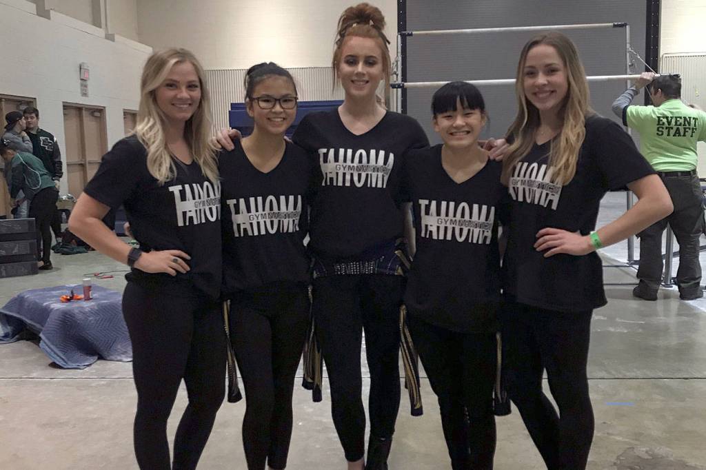 (From left to right) Tahoma coach Randi Schorzman, gymnasts Elsie Rochleau, Hayley Rayburn and Emma Rochleau and coach Erica Bonthuis pose for a photo during the weekends state meet. Courtesy photo