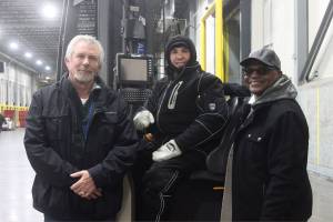 From left, Jeff Smith, Sergey Alter and Joseph Drake pose for a photo. Leah Abraham, Renton Reporter