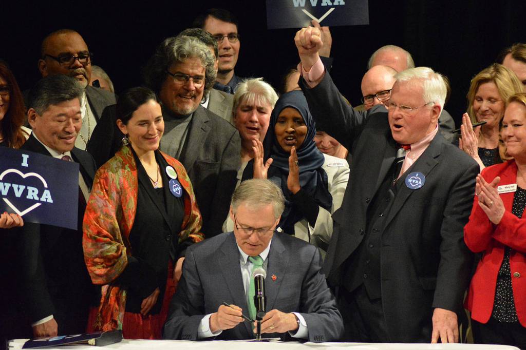 Gov. Jay Inslee signs package of bills at Foster High School