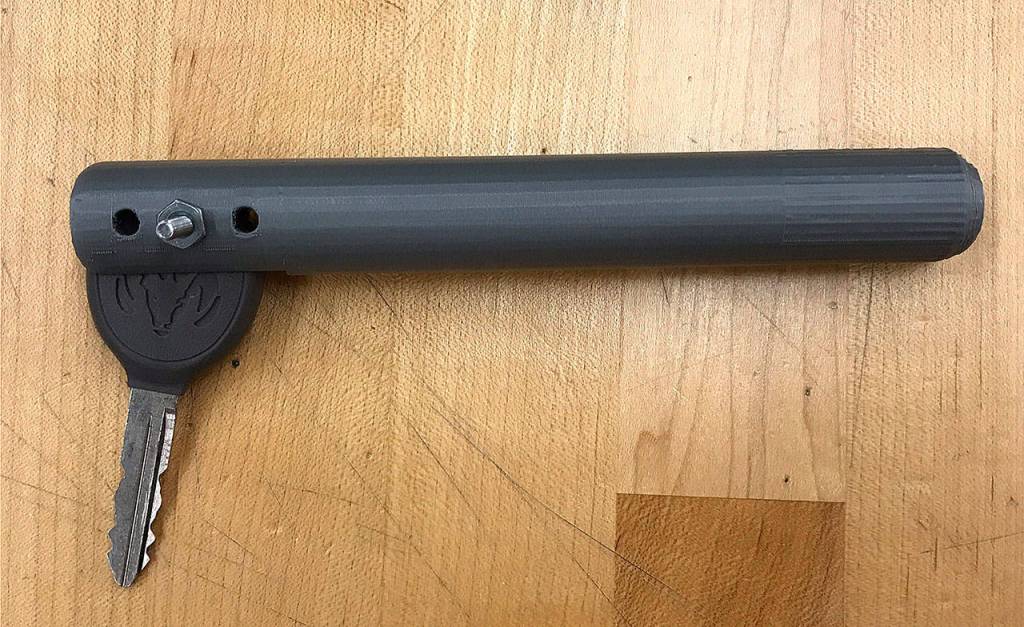 Sean Larue and his partner made a lever to attach to a car key that allows someone without mobility of their wrist to turn the key in the ignition more freely. This is one of the prototypes they made using a 3D printer.                                Photo by Kayse Angel