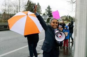Scenic Hill fifth-grader Ismail Moalim leads the crowd in front of Kent School District headquarters with uplifting words at the April 4 rally to push for the superintendents resignation. He cites his teachers as his inspiration for attending the rally. Megan Saunders photo, for the Reporter