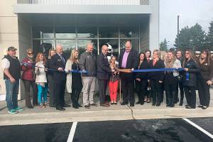 Marc Schuh, owner of the Covington Chick-fil-A, along with his wife, Covington Mayor Jeff Wagner and Covington Chamber of Commerce members cut the ribbon during opening day. Photo by Sarah Brenden