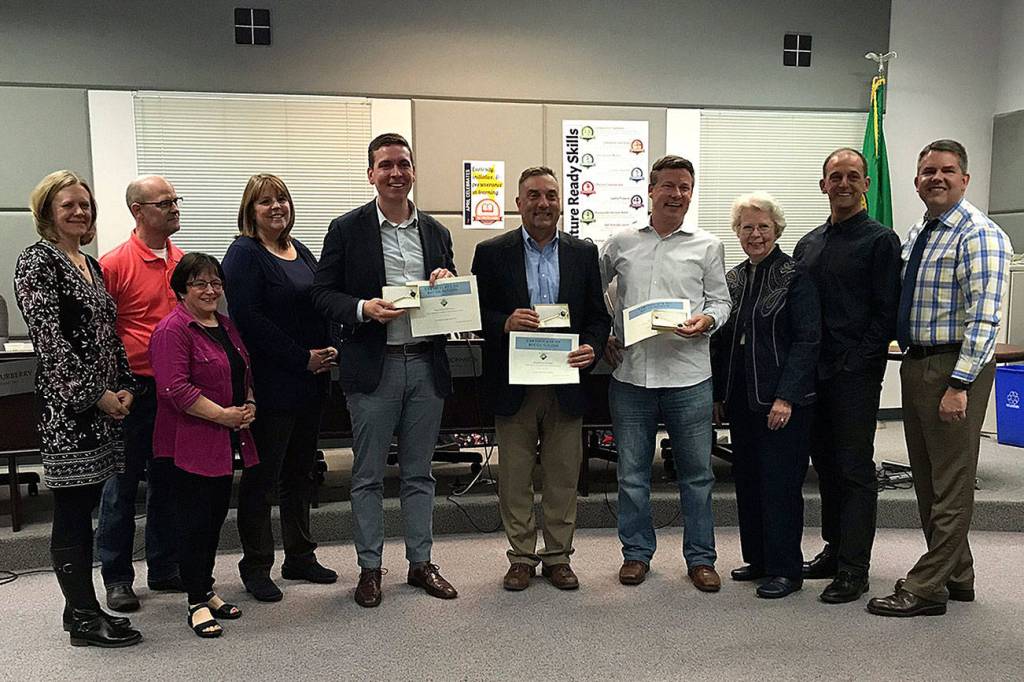 Maple Valley City Council and city manager pose with State Senator Mark Mullet, Rep. Jay Rodne and Rep. Paul Graves and await eating cupcakes to celebrate keys to the city being given to the legislatures. Photo by Kayse Angel