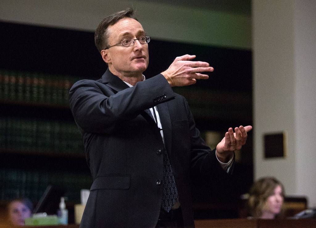 Snohomish County chief criminal deputy prosecutor Craig Matheson points his fingers like a gun as he makes opening statements at the Snohomish County Courthouse on Thursday in Everett in the trial of John Blaine Reed, accused of murdering Monique Patenaude and Patrick Shunn. (Andy Bronson / The Herald)