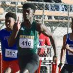 Kentridges Solomon Hines dashes to victory in the 100 meters at 10.87 seconds. RACHEL CIAMPI, Kent Reporter