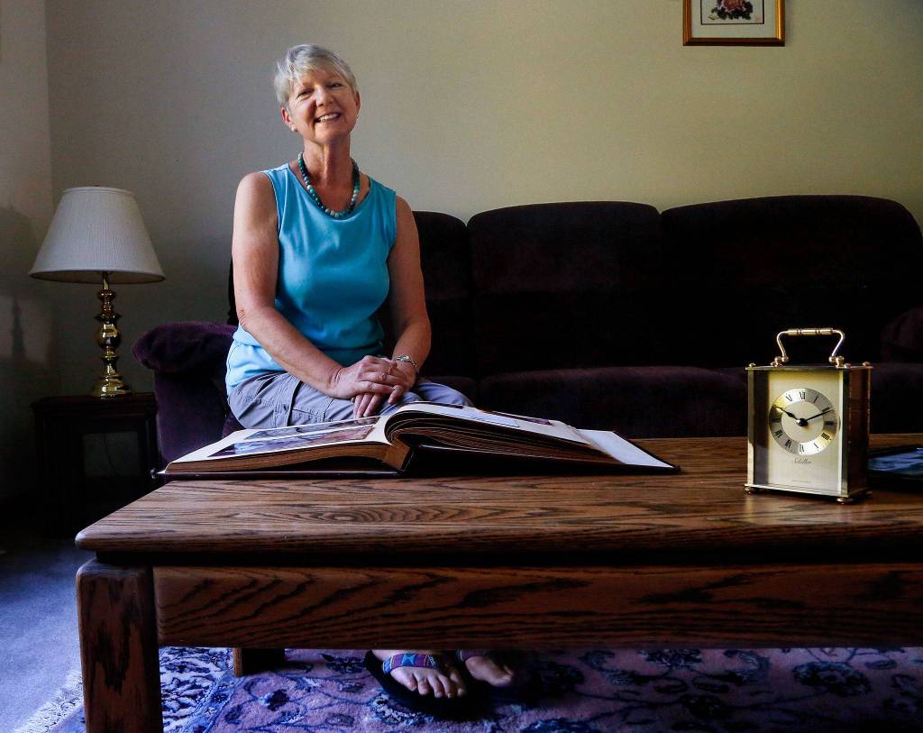 Snohomishs Janette Huskie, who worked two years as a Buckingham Palace housemaid and met the future Princess Diana, gets out her scrapbook of memories and talks about Saturdays royal wedding. (Dan Bates / The Herald)