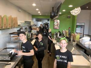 Employees at The Chopped Leaf prepare fresh ingredients for the restaurants bowls, salads and wraps. Courtesy Kevin Dueck