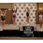 Gymnasts pose in their respected placements. Submitted photo